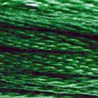 A close-up view of embroidery thread skeins, held taught horizontally. The shade is a medium dark true green, like conifers late in the evening