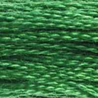 A close-up view of embroidery thread skeins, held taught horizontally. The shade is a medium  true green, like the new-growth tips of a spruce tree