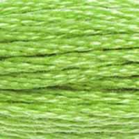 A close-up view of embroidery thread skeins, held taught horizontally. The shade is a bright light green with a light touch of yellow, like a glass of lime juice