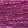 A close-up view of embroidery thread skeins, held taught horizontally. The shade is a lovely shade of pinkish purple, like the McDonald's Grimace