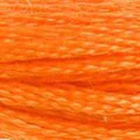 A close-up view of embroidery thread skeins, held taught horizontally. The shade is a beautiful bright orange, like a glass of orange soda