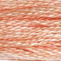 A close-up view of embroidery thread skeins, held taught horizontally. The shade is a pretty orangish pink, like peach-flavoured candy