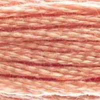 A close-up view of embroidery thread skeins, held taught horizontally. The shade is a medium orangish pink, like salmon steak