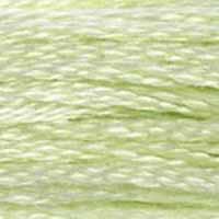 A close-up view of embroidery thread skeins, held taught horizontally. The shade is a very light green with yellowish undertones, like the sun seen through leaves