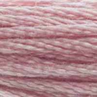 A close-up view of embroidery thread skeins, held taught horizontally. The shade is a very light purple with slight pink undertones, like strawberry milk