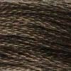 A close-up view of embroidery thread skeins, held taught horizontally. The shade is a very dark muddy brown, like a waterlogged branch in a river