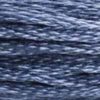 A close-up view of embroidery thread skeins, held taught horizontally. The shade is a medium dark blue with hints of grey, like deep water under moonlight