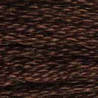 A close-up view of embroidery thread skeins, held taught horizontally. The shade is a deep dark coffee brown like a full bodied cup of coffee. In a brown cup.