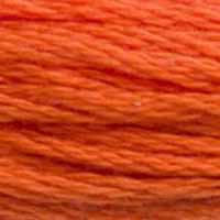 A close-up view of embroidery thread skeins, held taught horizontally. The shade is a medium orange with a touch of brick. Very pretty!