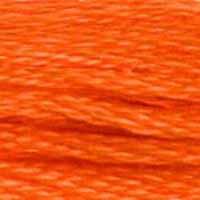 A close-up view of embroidery thread skeins, held taught horizontally. The shade is a medium light orange with a touch of brick. Very pretty!