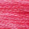 A close-up view of embroidery thread skeins, held taught horizontally. The shade is a lovely medium bright pink, like the fringes of a sunset.