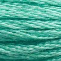 A close-up view of embroidery thread skeins, held taught horizontally. The shade is a medium bluish green, like polished jade.