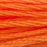 A close-up view of embroidery thread skeins, held taught horizontally. The shade is a pretty medium light true orange, like the orange stripe on a piece of candy corn.