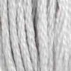 A close-up view of embroidery thread skeins, held taught vertically. The shade is a grey that's almost white