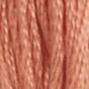 A close-up view of embroidery thread skeins, held taught vertically. The shade is a brownish peach