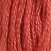 A close-up view of embroidery thread skeins, held taught vertically. The shade is a dark salmon
