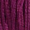 A close-up view of embroidery thread skeins, held taught vertically. The shade is a muted purple