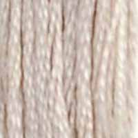 A close-up view of embroidery thread skeins, held taught vertically. The shade is a light cream