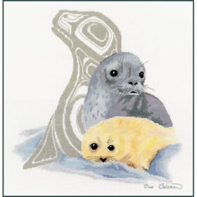 A mother harp seal and her fluffy white pup lay on a snowbank. A silver Native-styled line-art of a seal watches over them.