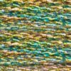A close-up view of embroidery thread skeins, held taught horizontally. The shade is a metallic gradient of gold and green
