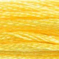 A close-up view of embroidery thread skeins, held taught horizontally. The shade is a light lemon yellow, not too intense, like a banana cream Popsicle