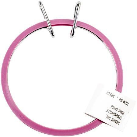 A large plastic embroidery hoops, closed with a pair of metal spring clamps.