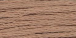 A close-up view of embroidery thread skeins, held taught horizontally. The shade is a tawny brown, like the shore of a swimming hole.